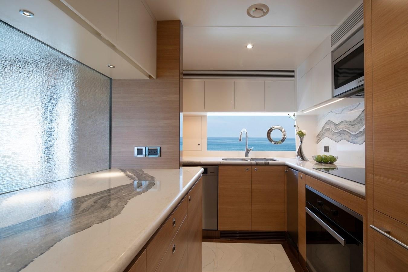 a kitchen with white cabinets aboard FD92 (NEW BOAT SPEC)  Yacht for Sale