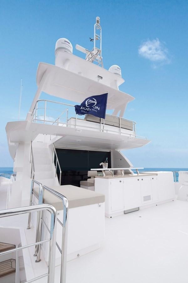 a white boat with a blue flag on it aboard FD92 (NEW BOAT SPEC)  Yacht for Sale