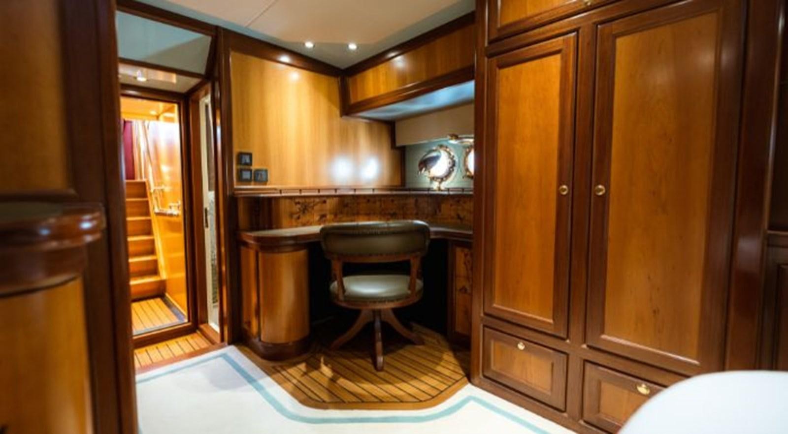 a kitchen with wooden cabinets aboard TELSTAR VI Yacht for Sale