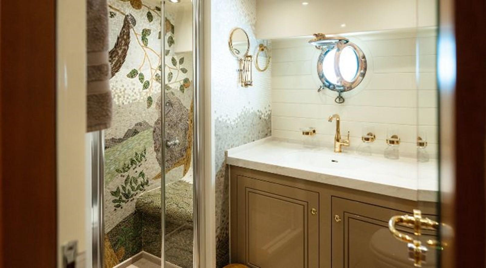 a bathroom with a sink and a shower aboard TELSTAR VI Yacht for Sale