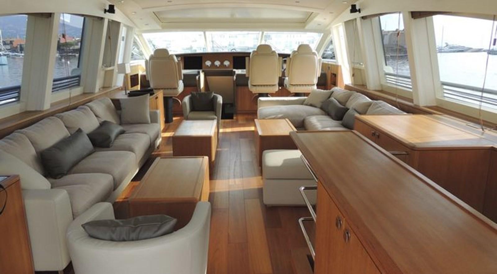 a room with a couch and a table aboard NOE Yacht for Sale