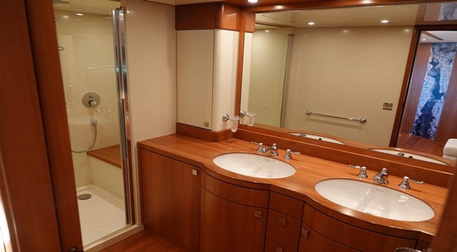 a bathroom with a large mirror aboard NOE Yacht for Sale