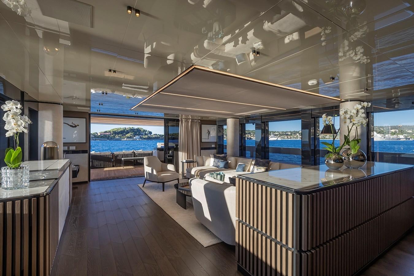 a modern looking living room with a large open roof aboard X96 TRIPLEX HULL.4  Yacht for Sale