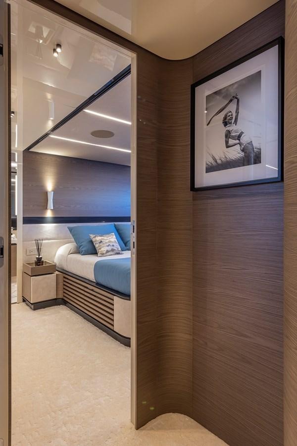 a room with a bed and a mirror aboard X96 TRIPLEX HULL.4  Yacht for Sale