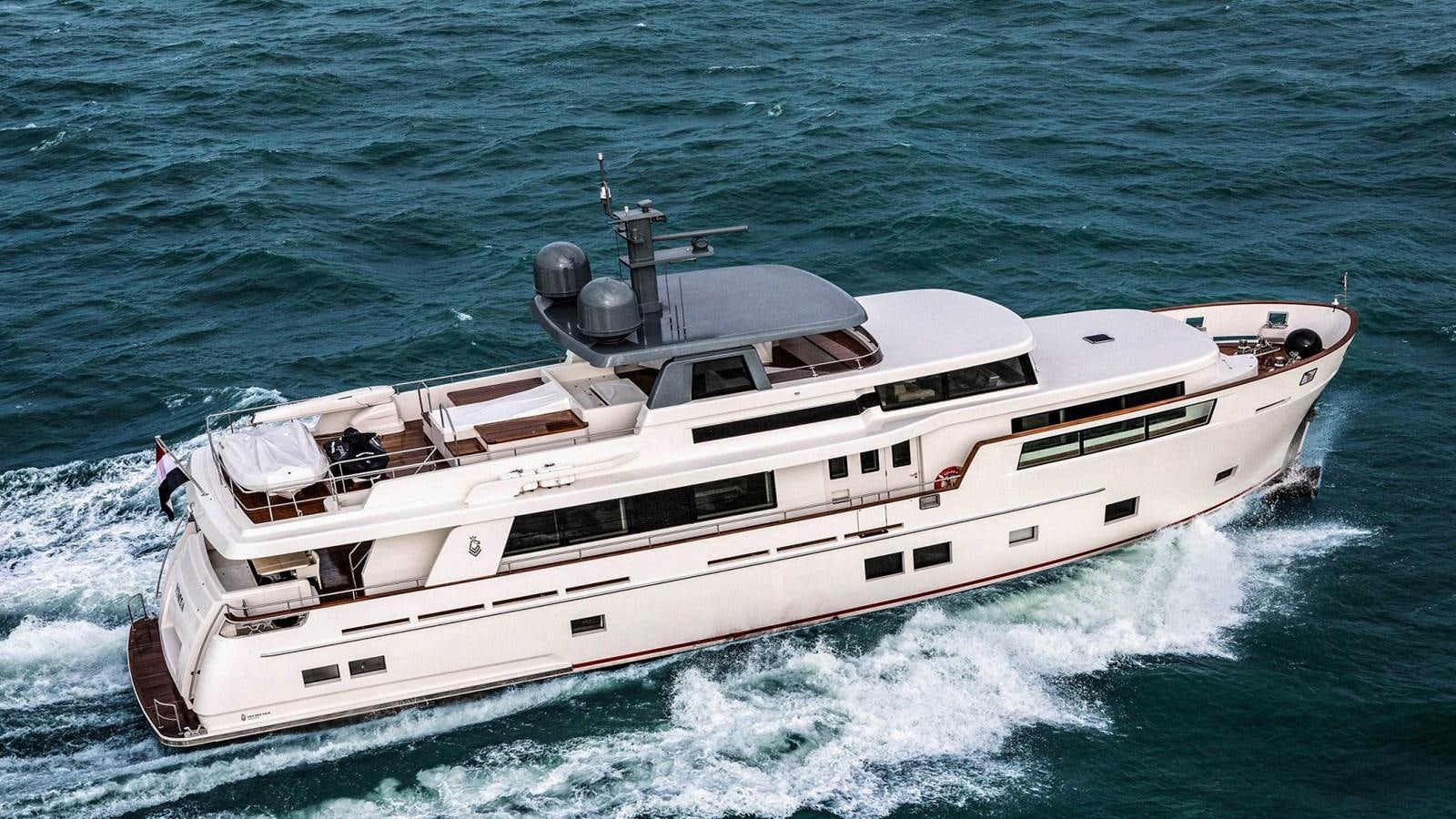 a white yacht on the water aboard BLONDIE Yacht for Sale