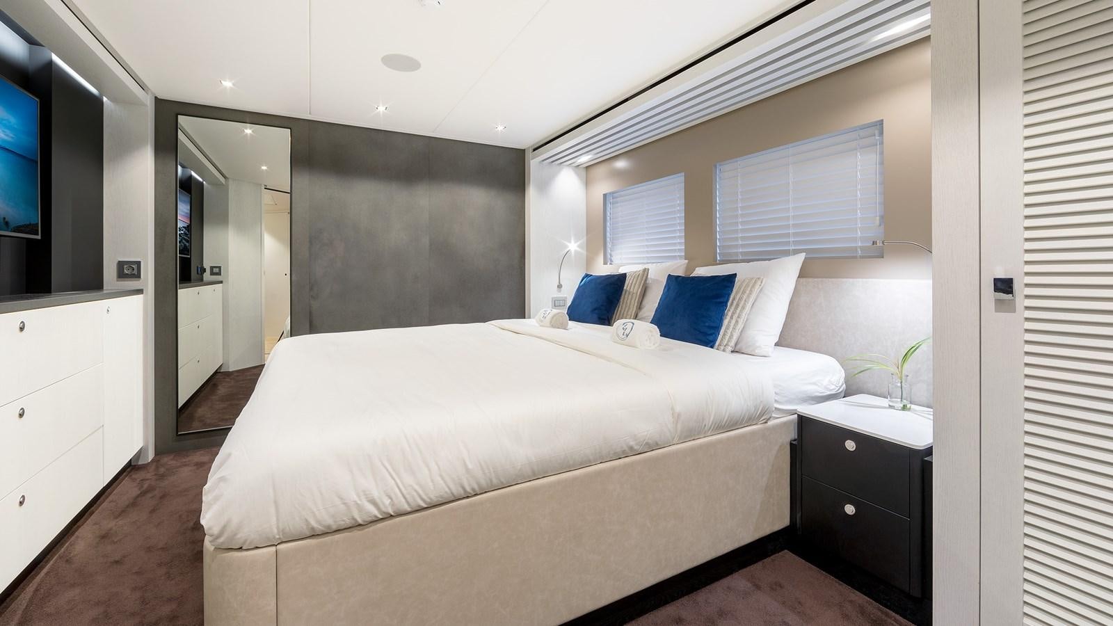 a bed in a room aboard BLONDIE Yacht for Sale