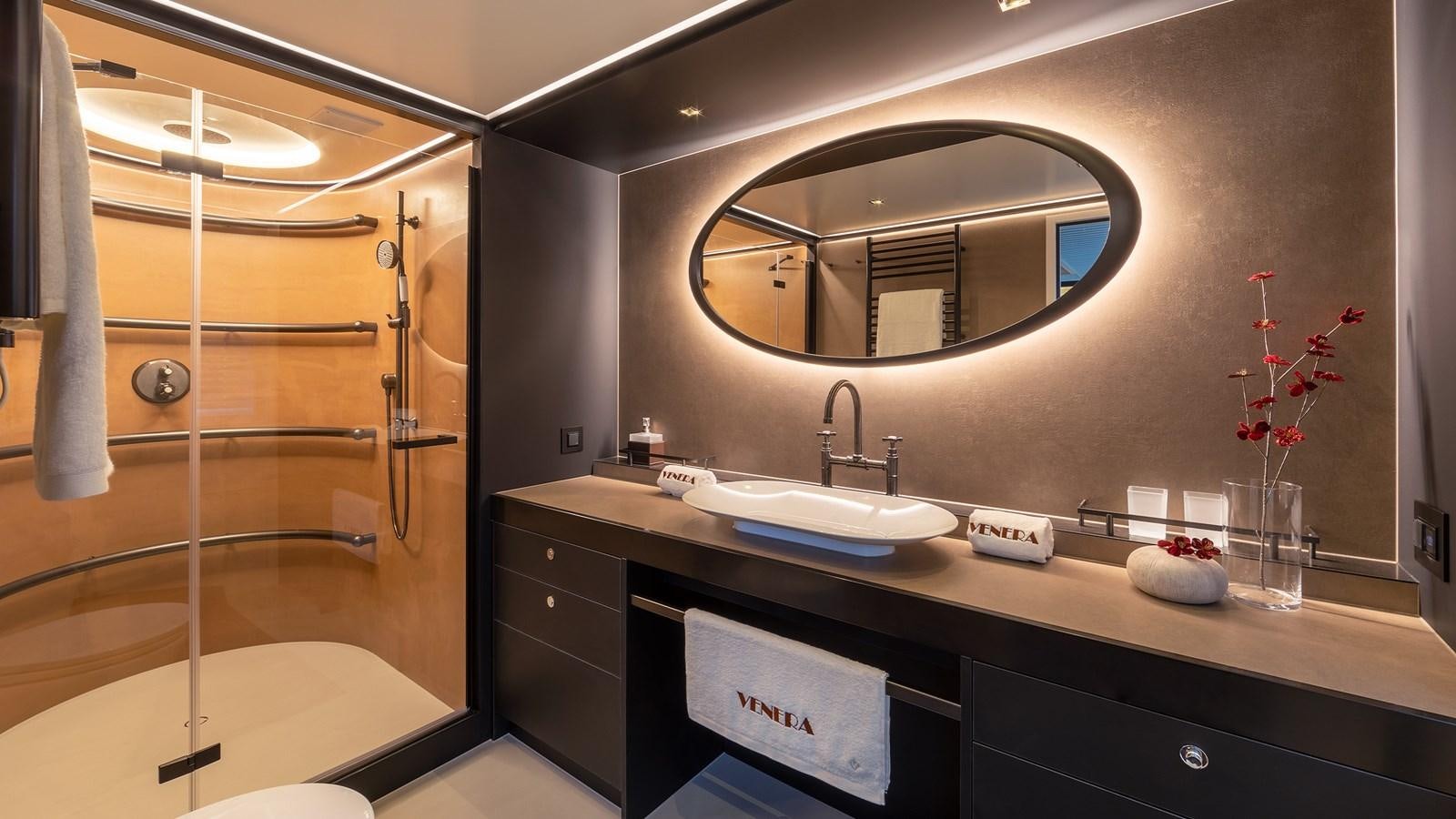 a bathroom with a large mirror aboard BLONDIE Yacht for Sale