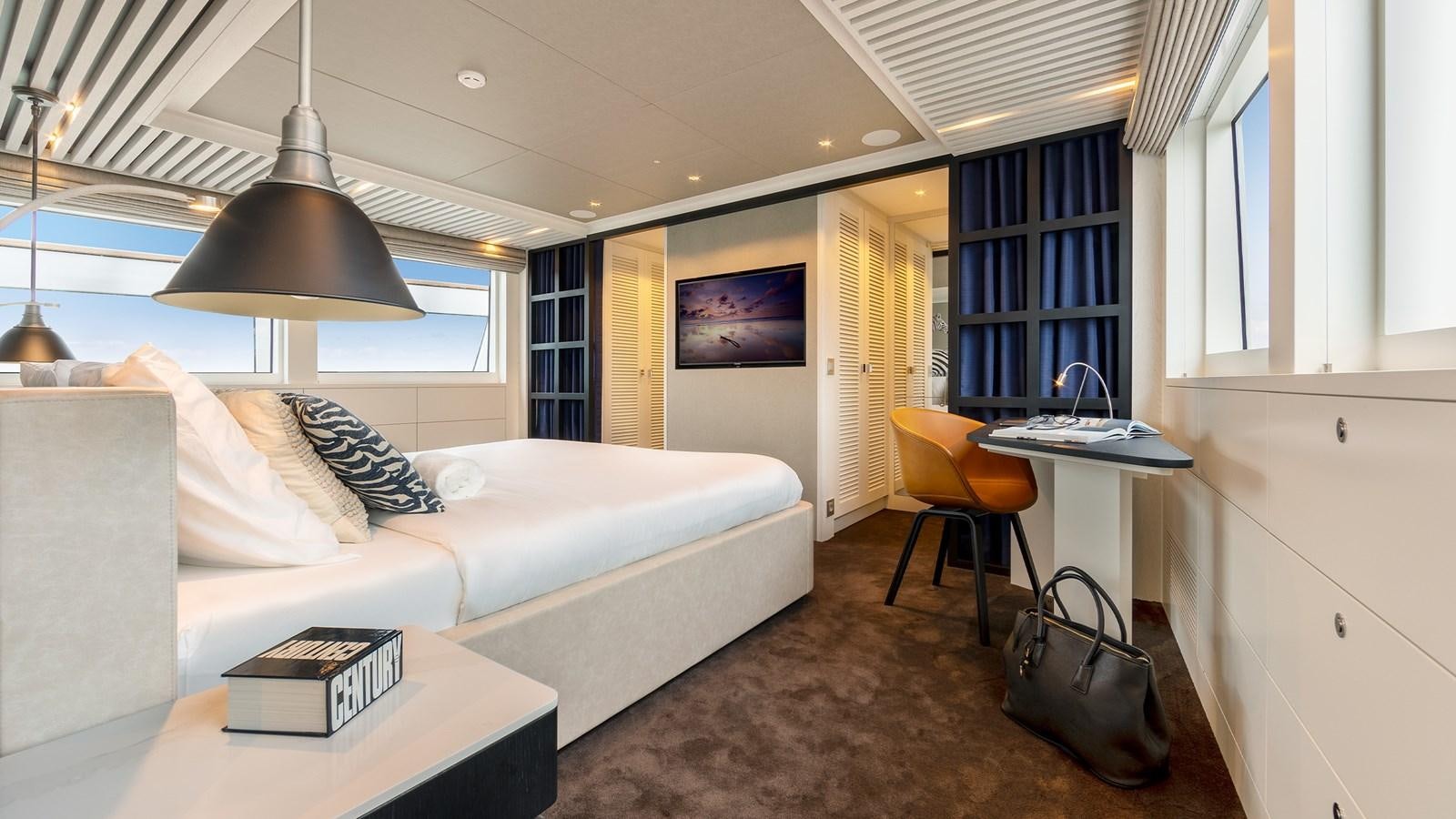 a living room with a couch and a desk aboard BLONDIE Yacht for Sale