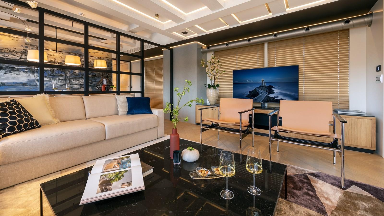a living room with a large screen aboard BLONDIE Yacht for Sale