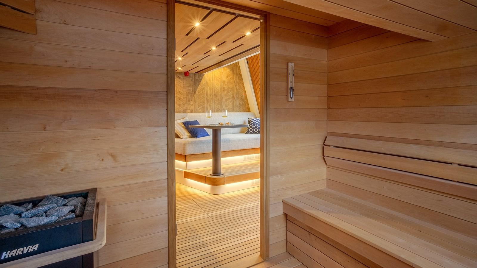 a room with a wood floor and a bed in it aboard BLONDIE Yacht for Sale