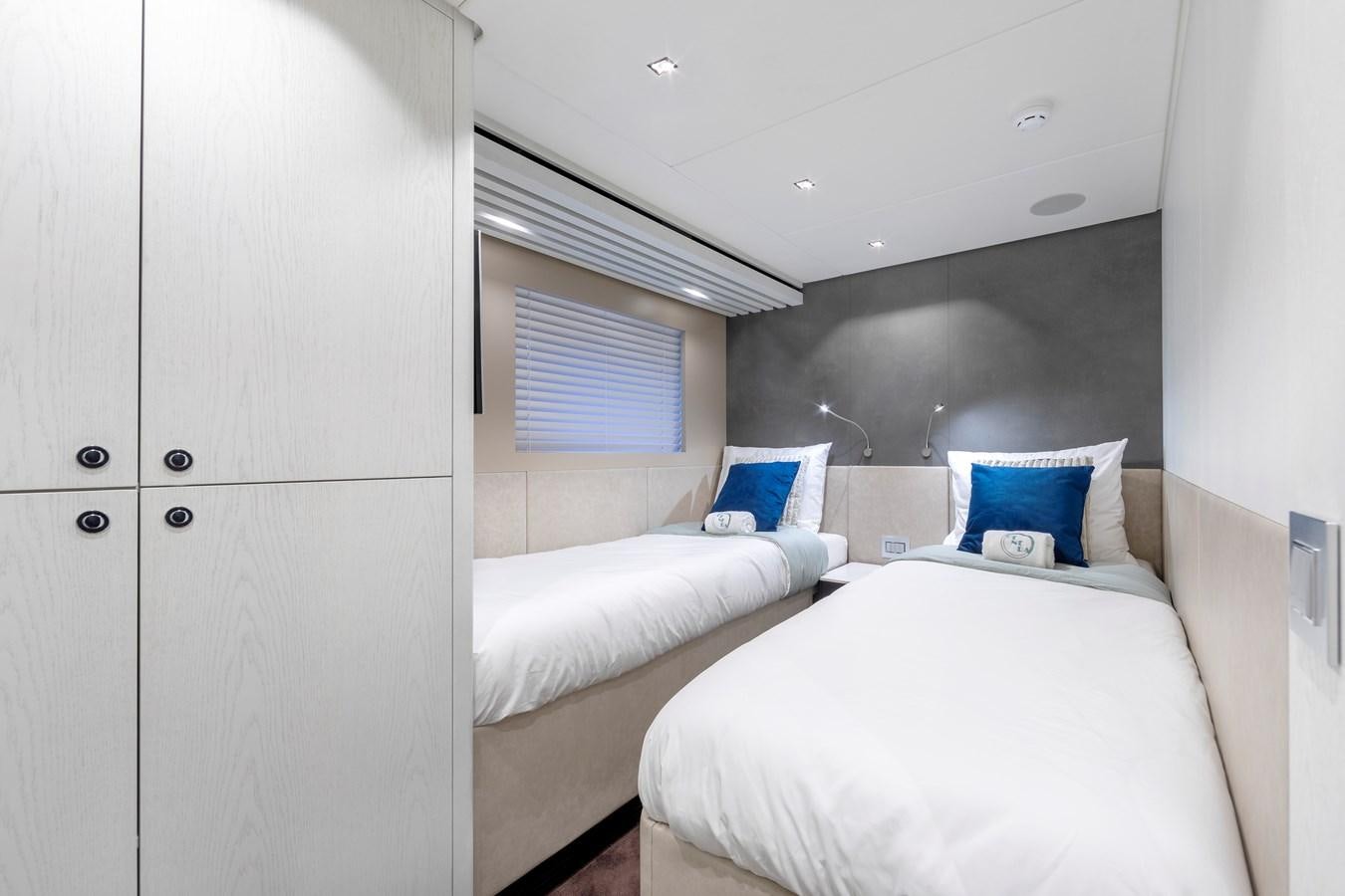 a room with two beds aboard BLONDIE Yacht for Sale