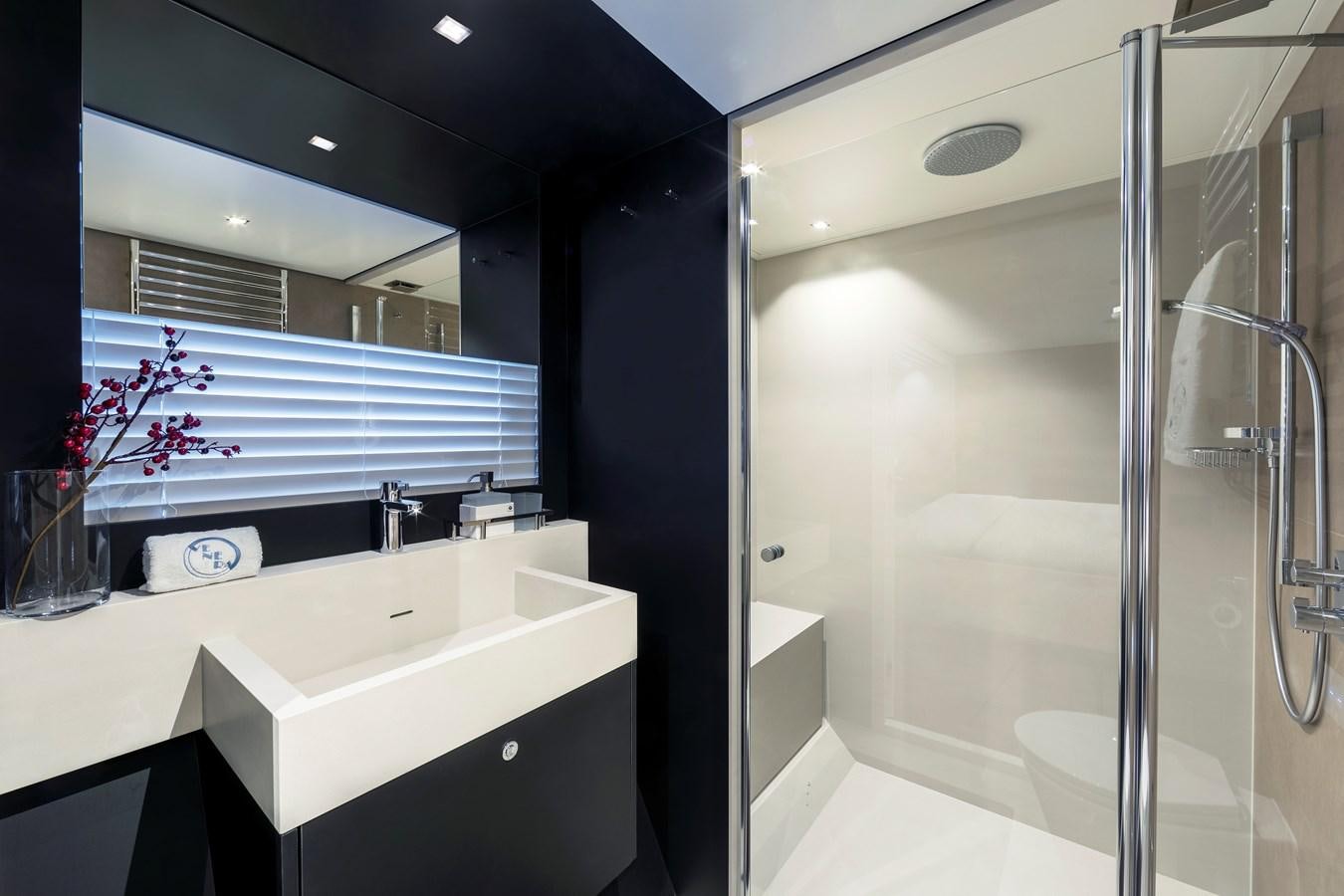 a bathroom with a sink and a shower aboard BLONDIE Yacht for Sale