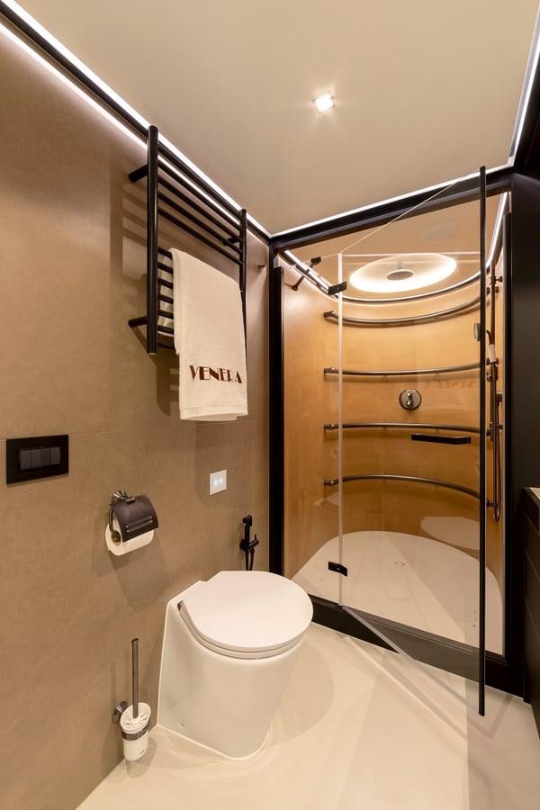 a bathroom with a toilet and a sink aboard BLONDIE Yacht for Sale