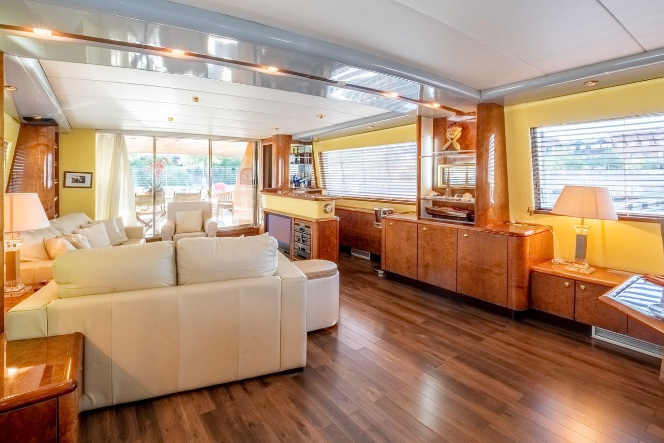 a living room with a wood floor aboard TIENNA Yacht for Sale