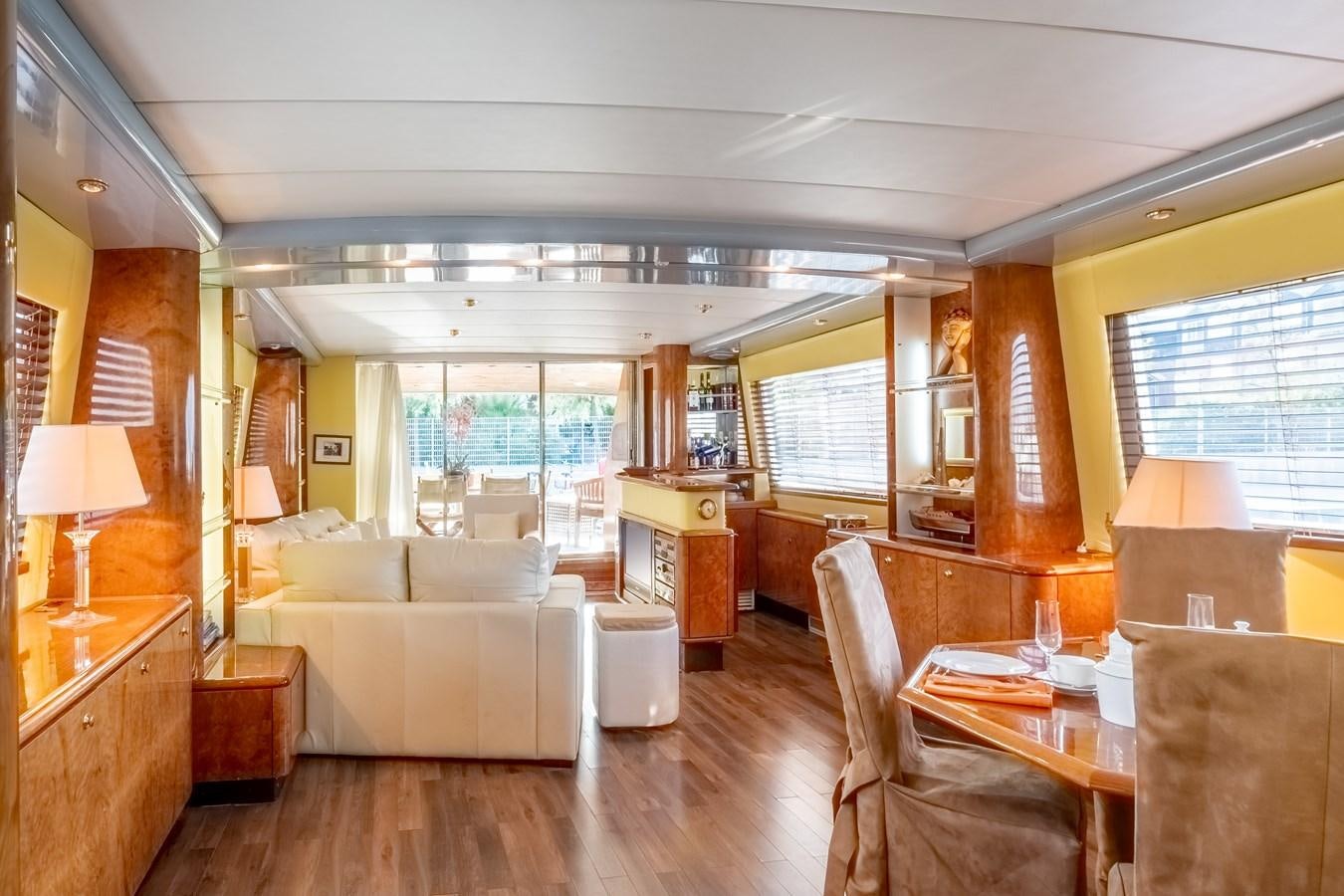 a living room with a large window aboard TIENNA Yacht for Sale