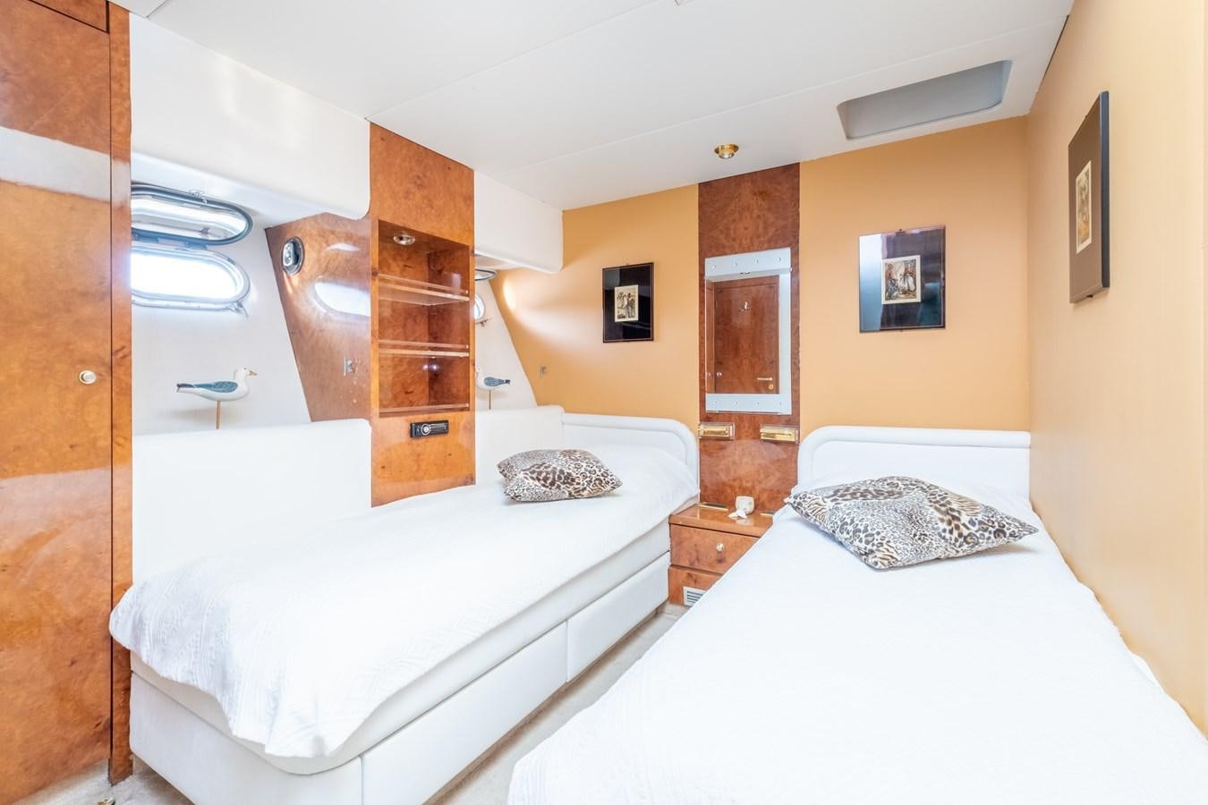 a couple of beds in a room aboard TIENNA Yacht for Sale
