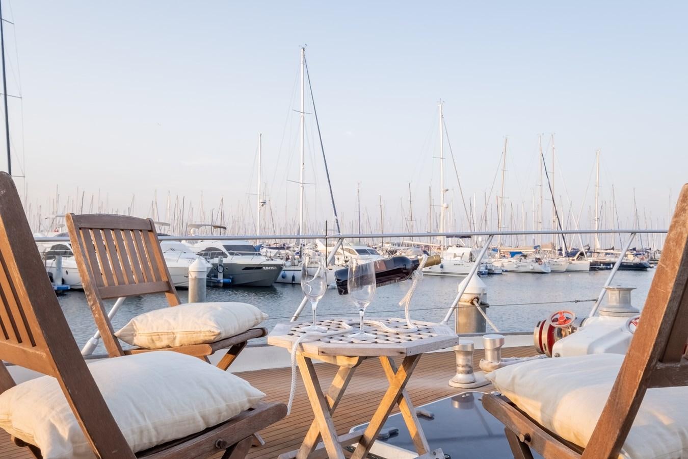 a boat is parked in a harbor aboard TIENNA Yacht for Sale