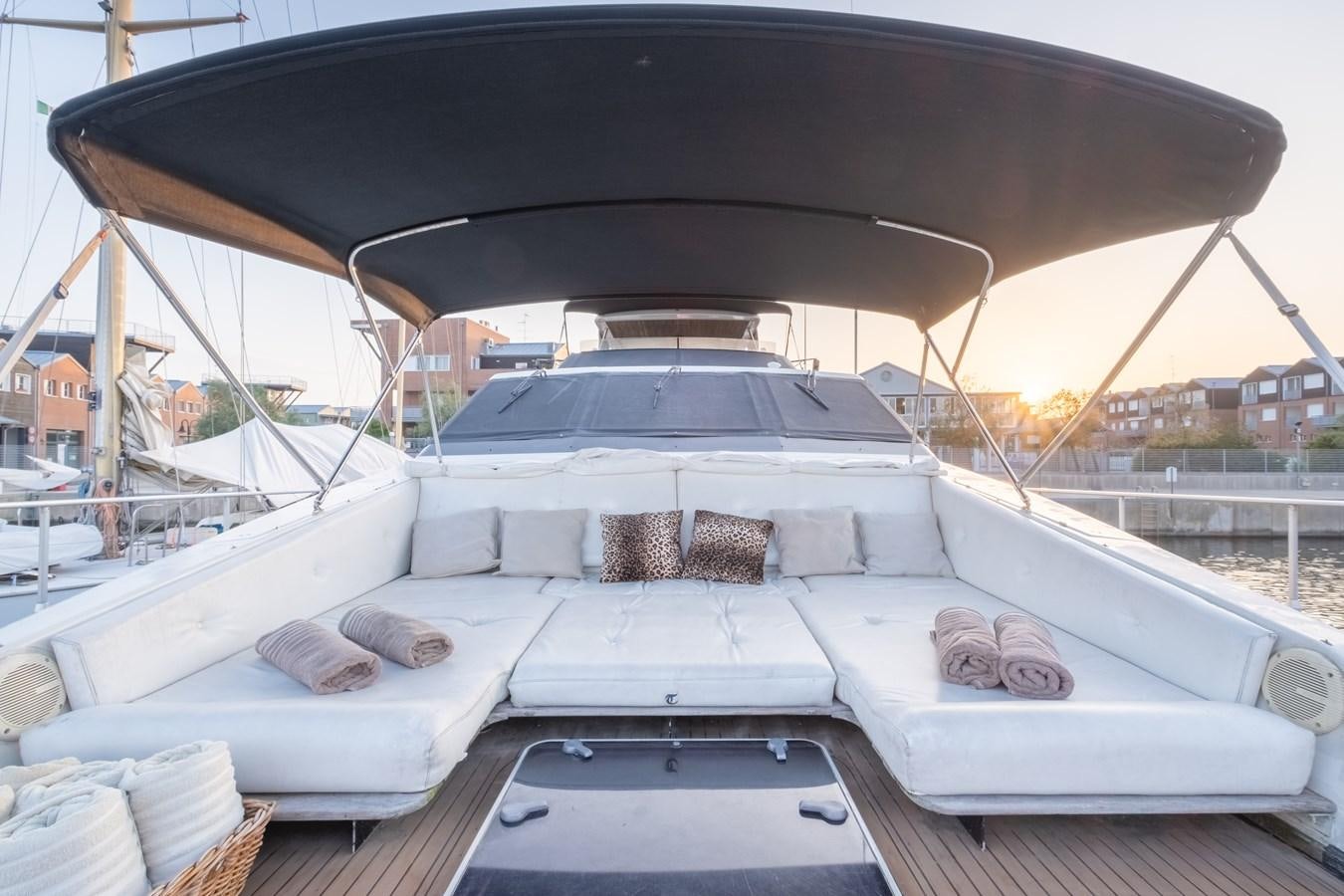 a white boat with a black umbrella aboard TIENNA Yacht for Sale