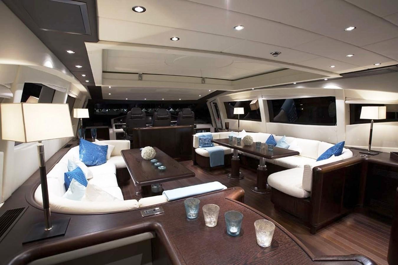a living room with a couch and a table aboard L'ESPERANCE Yacht for Sale