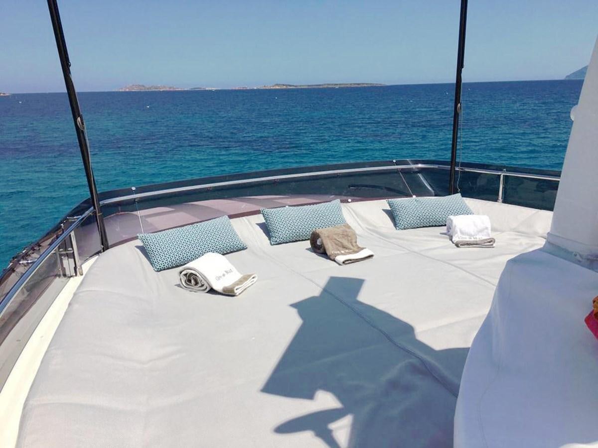 a deck with chairs and a body of water in the background aboard PALGREMAT Yacht for Sale