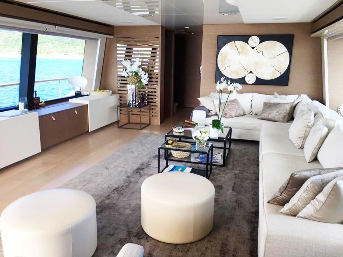 a living room with a couch and a coffee table aboard PALGREMAT Yacht for Sale