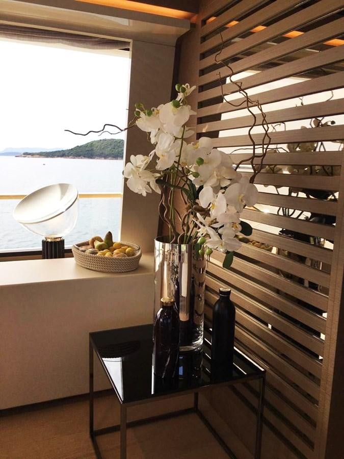 a table with vases and flowers aboard PALGREMAT Yacht for Sale