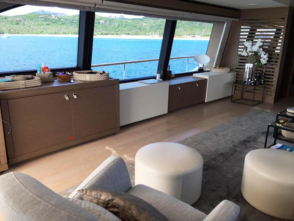 a living room with a large window aboard PALGREMAT Yacht for Sale