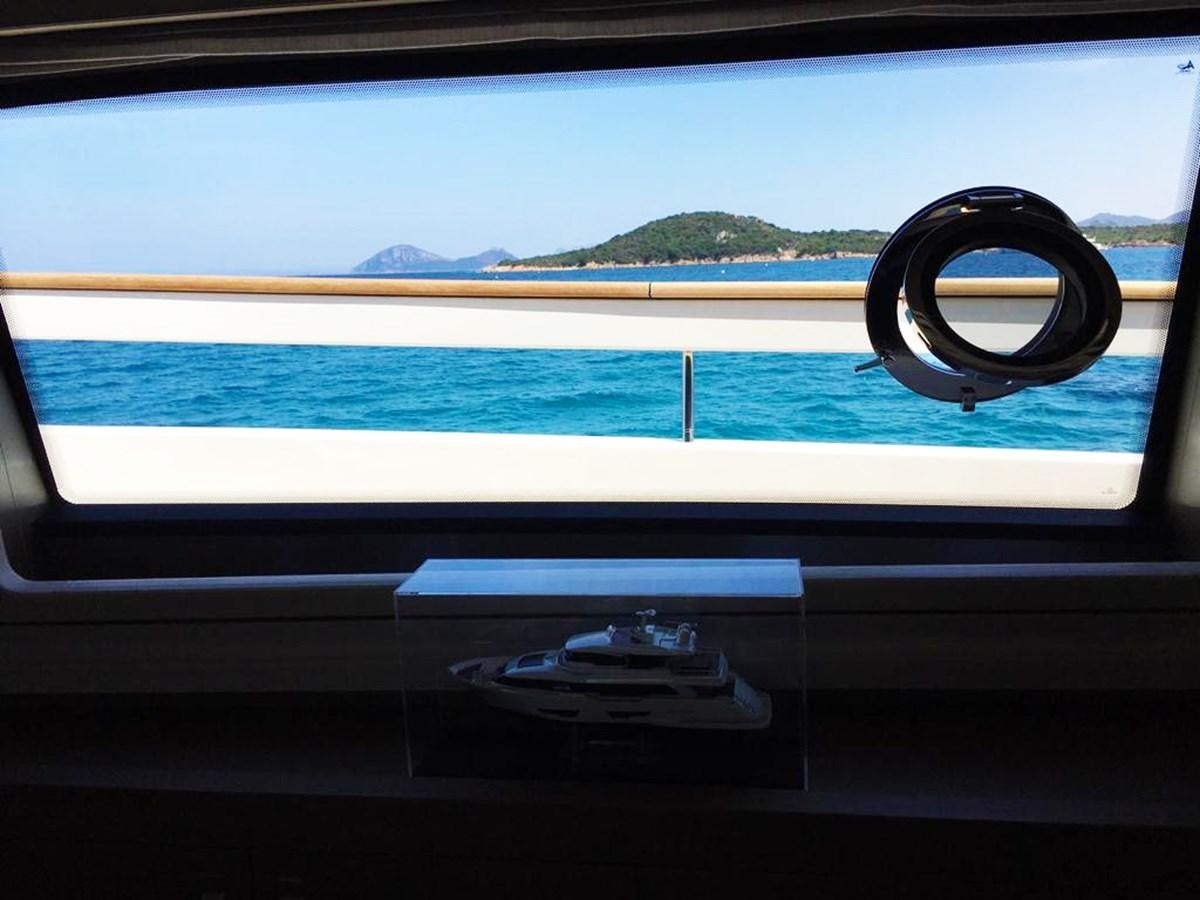 a window with a railing overlooking a body of water aboard PALGREMAT Yacht for Sale