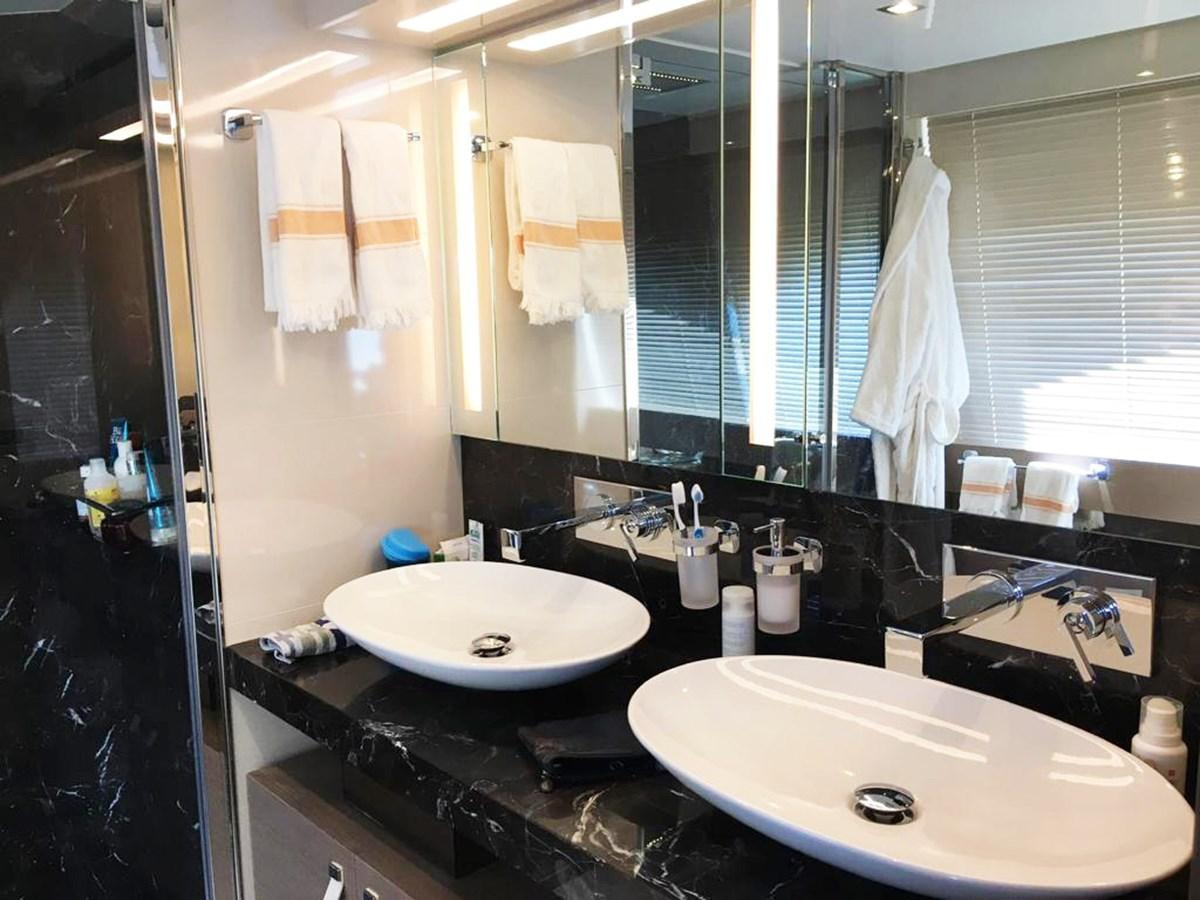 a bathroom with sinks and mirrors aboard PALGREMAT Yacht for Sale
