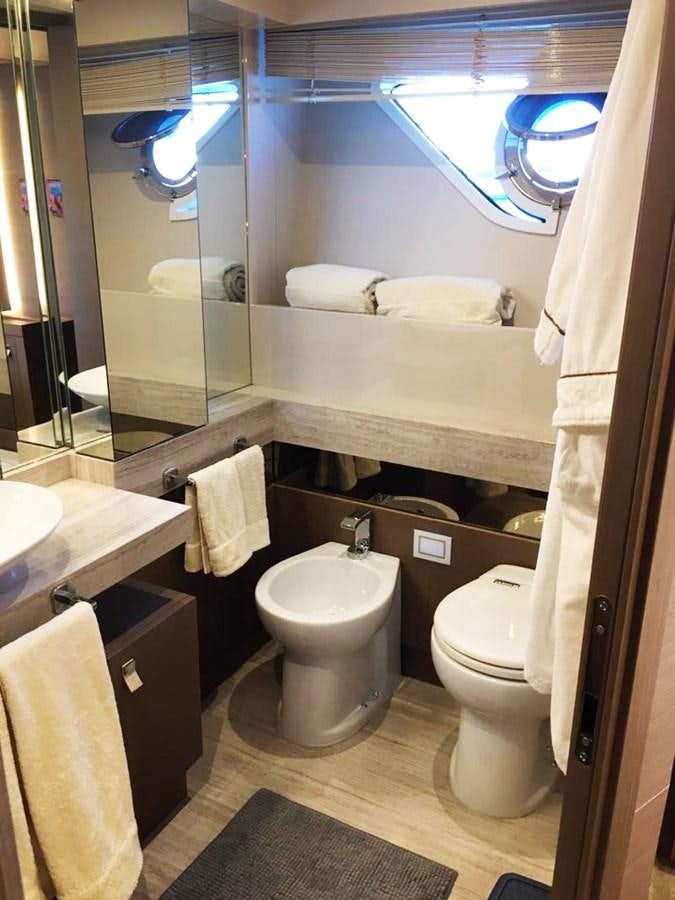 a bathroom with a large mirror aboard PALGREMAT Yacht for Sale