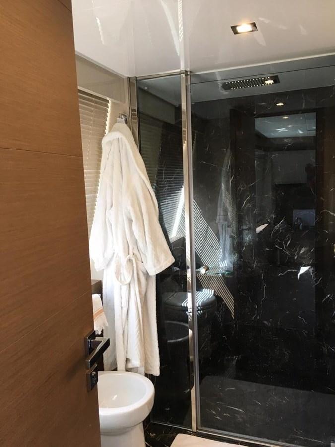 a bathroom with a glass shower aboard PALGREMAT Yacht for Sale