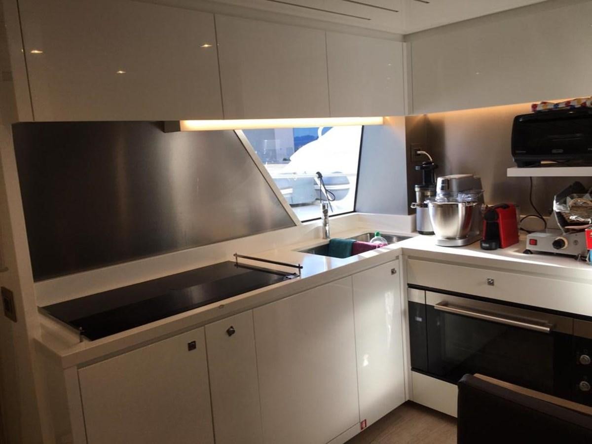 a kitchen with a large tv aboard PALGREMAT Yacht for Sale