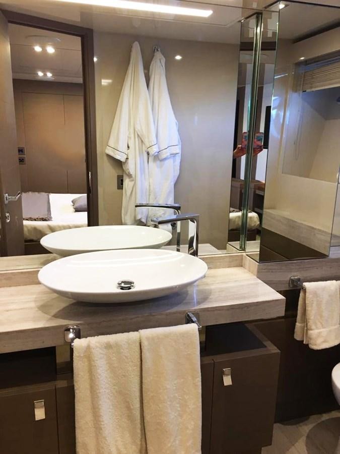 a bathroom with a sink and a mirror aboard PALGREMAT Yacht for Sale