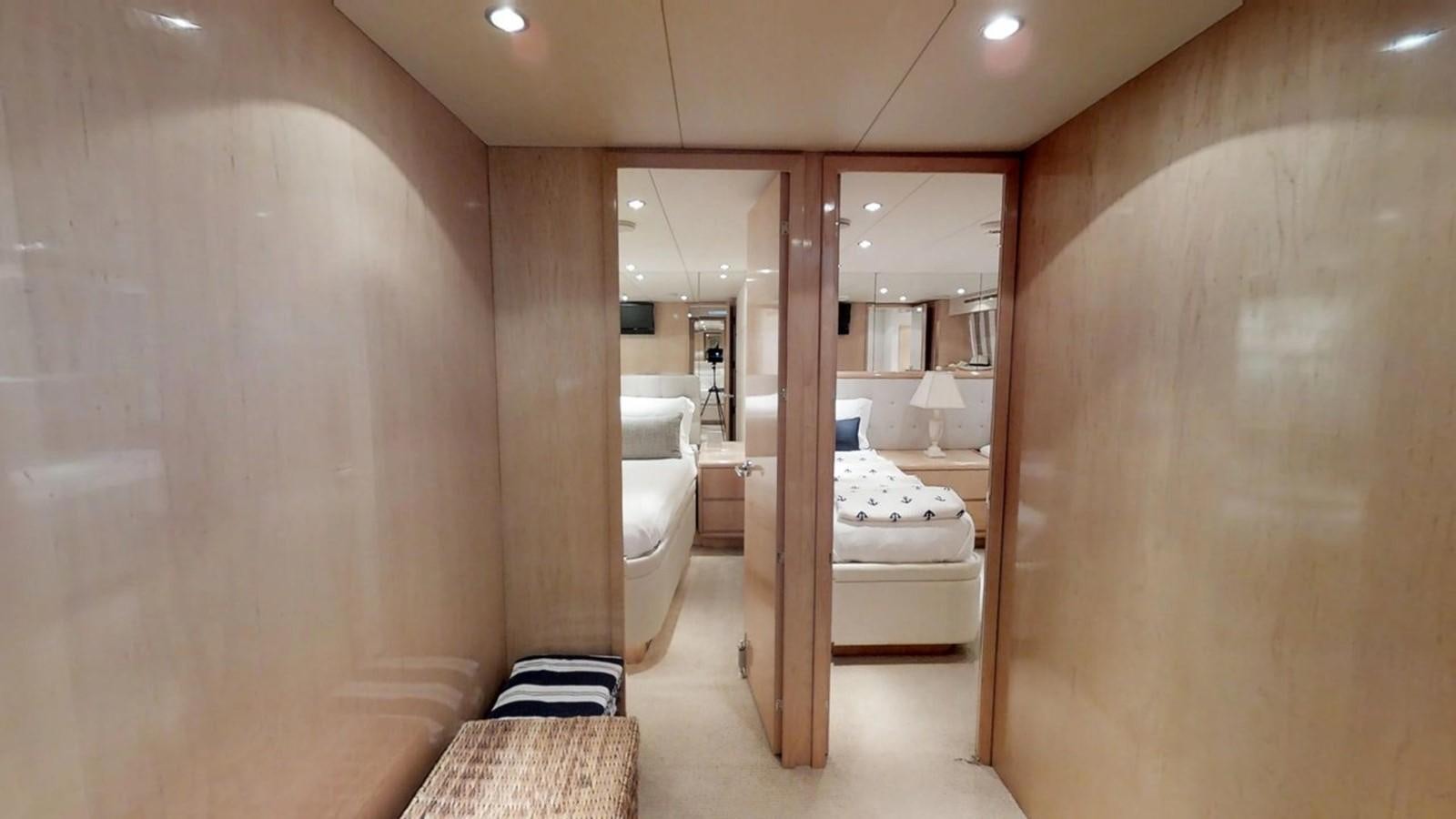 a bathroom with a large mirror aboard 92' HATTERAS Yacht for Sale