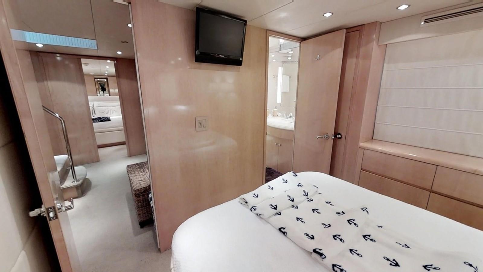 a hotel room with a bed aboard 92' HATTERAS Yacht for Sale