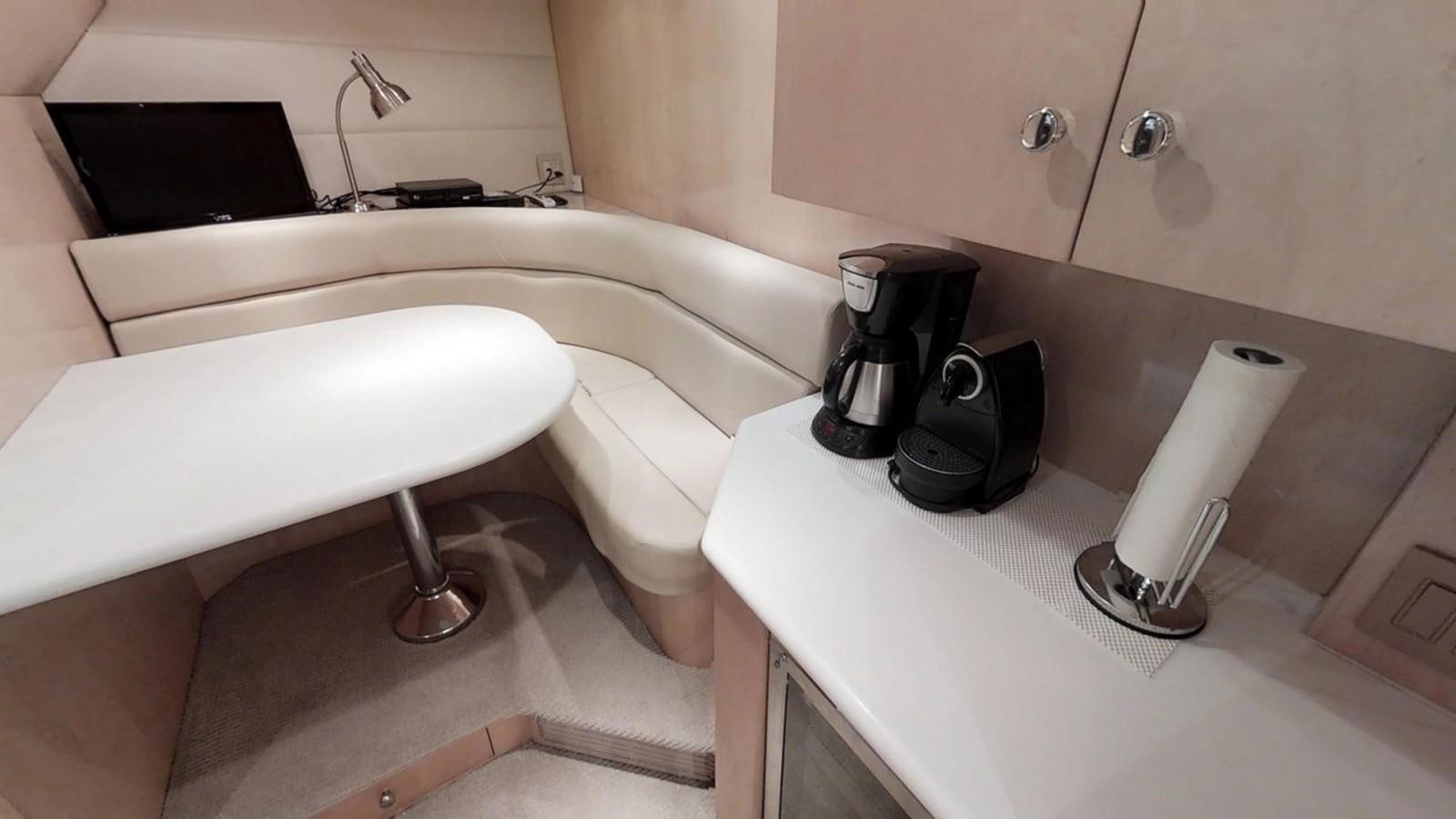 a bathroom with a white tub and a black coffee maker aboard 92' HATTERAS Yacht for Sale