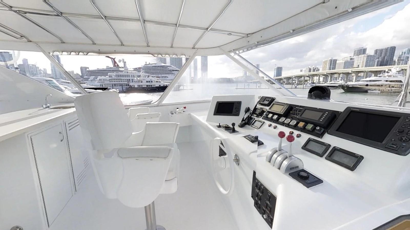 inside of a car aboard 92' HATTERAS Yacht for Sale