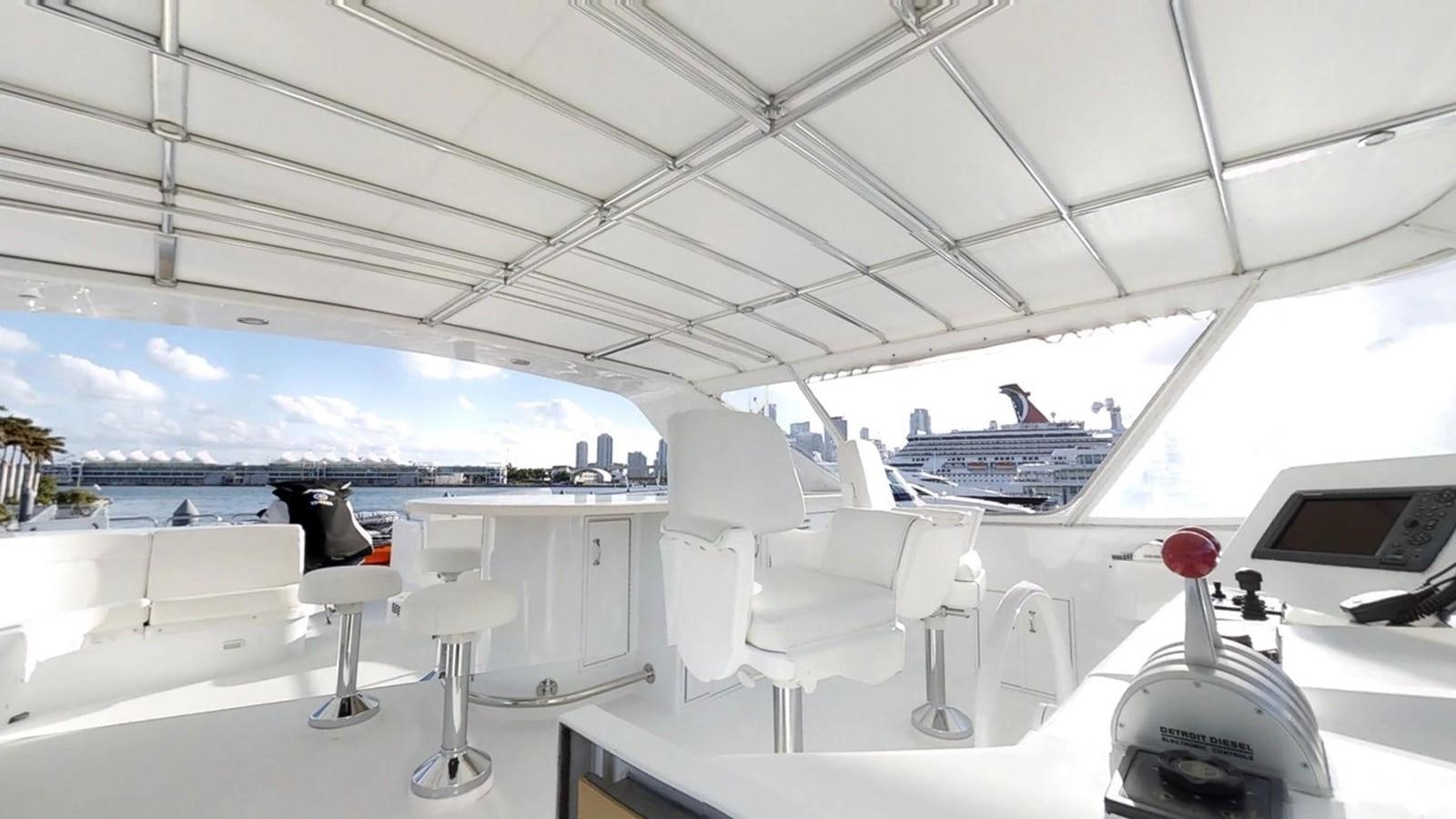 a boat with a red rose in the front aboard 92' HATTERAS Yacht for Sale