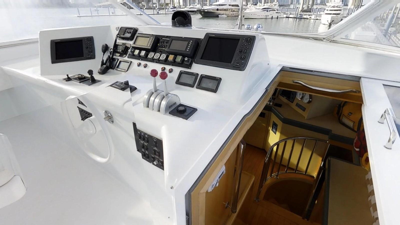 a white machine with black buttons aboard 92' HATTERAS Yacht for Sale