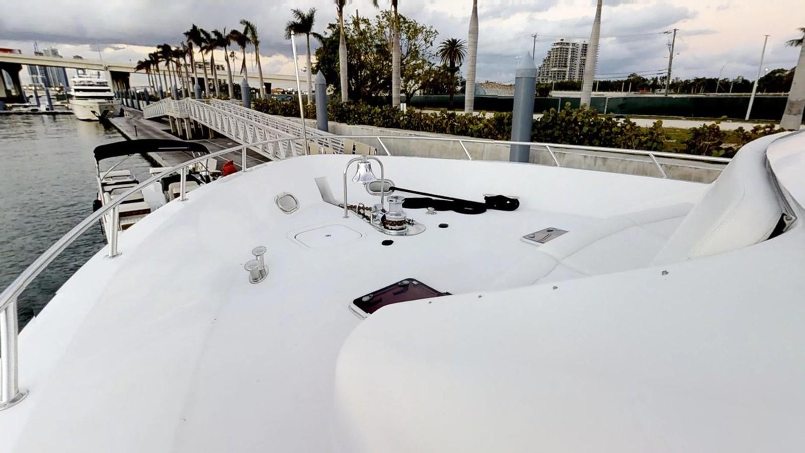 a white boat with a black handle aboard 92' HATTERAS Yacht for Sale