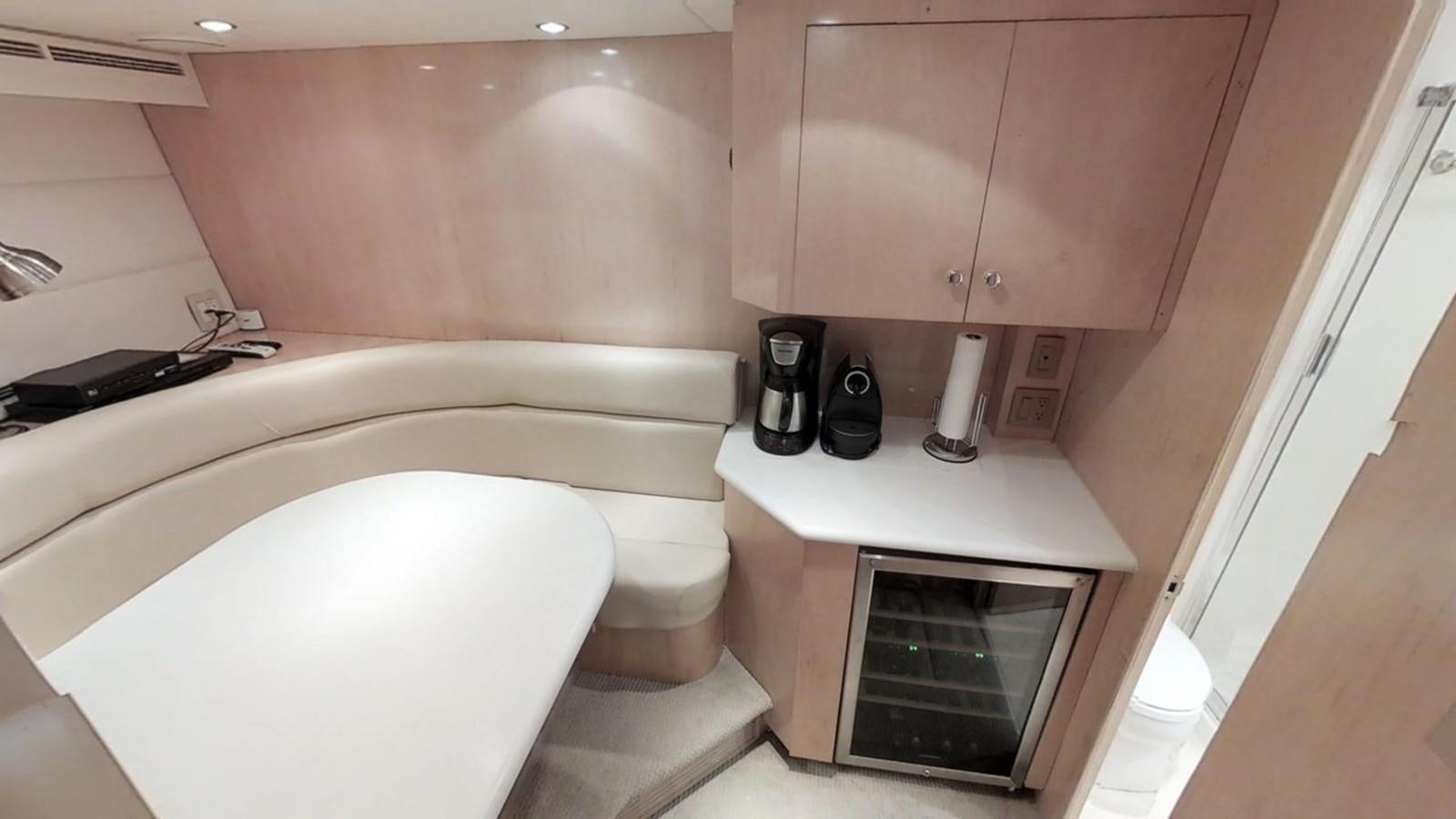 a bathroom with a bathtub and a sink aboard 92' HATTERAS Yacht for Sale
