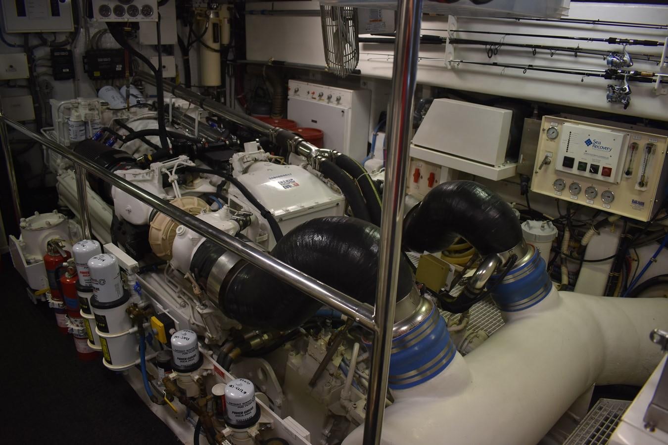 a machine with a large metal pipe aboard 92' HATTERAS Yacht for Sale