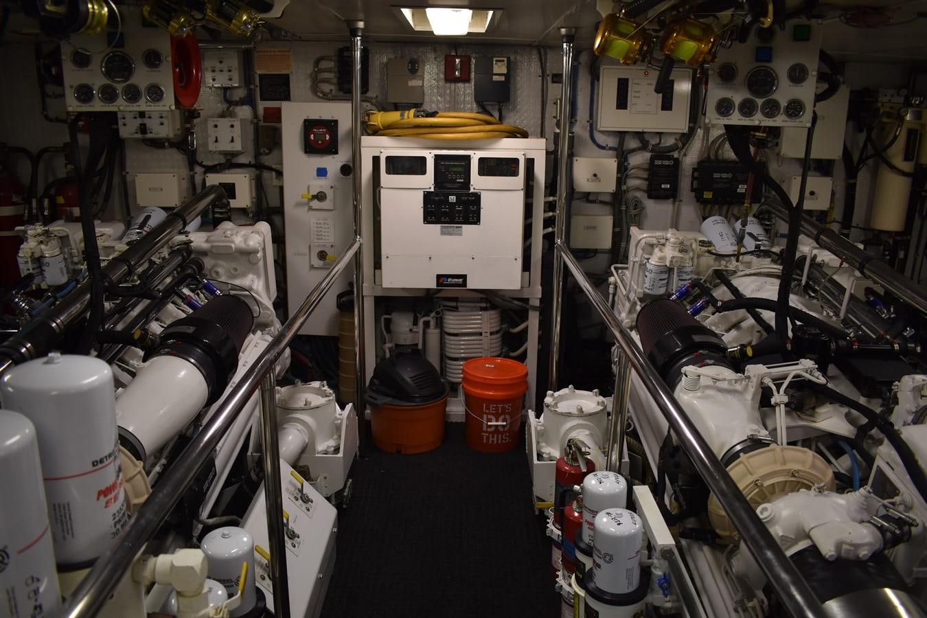 a room full of machinery aboard 92' HATTERAS Yacht for Sale