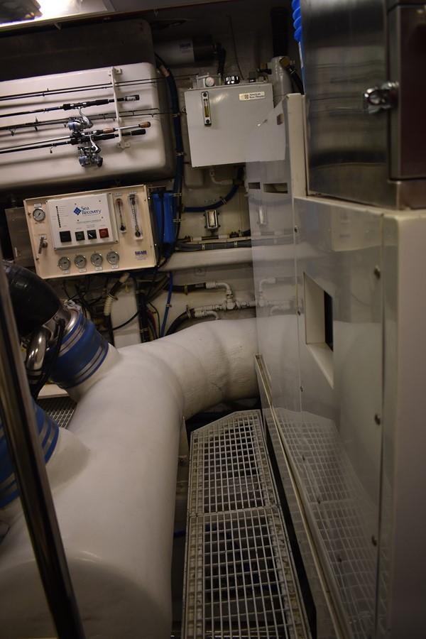 a person's legs and a metal rack with a wire aboard 92' HATTERAS Yacht for Sale