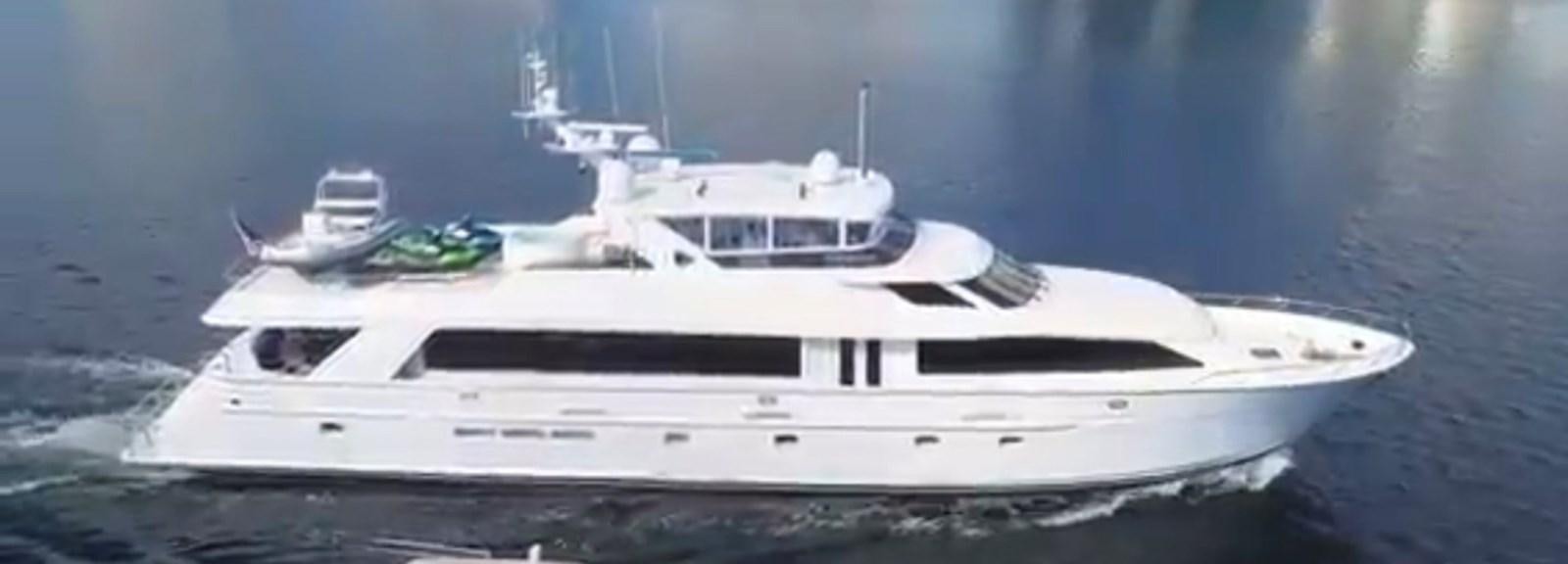 a white yacht in the water aboard 92' HATTERAS Yacht for Sale