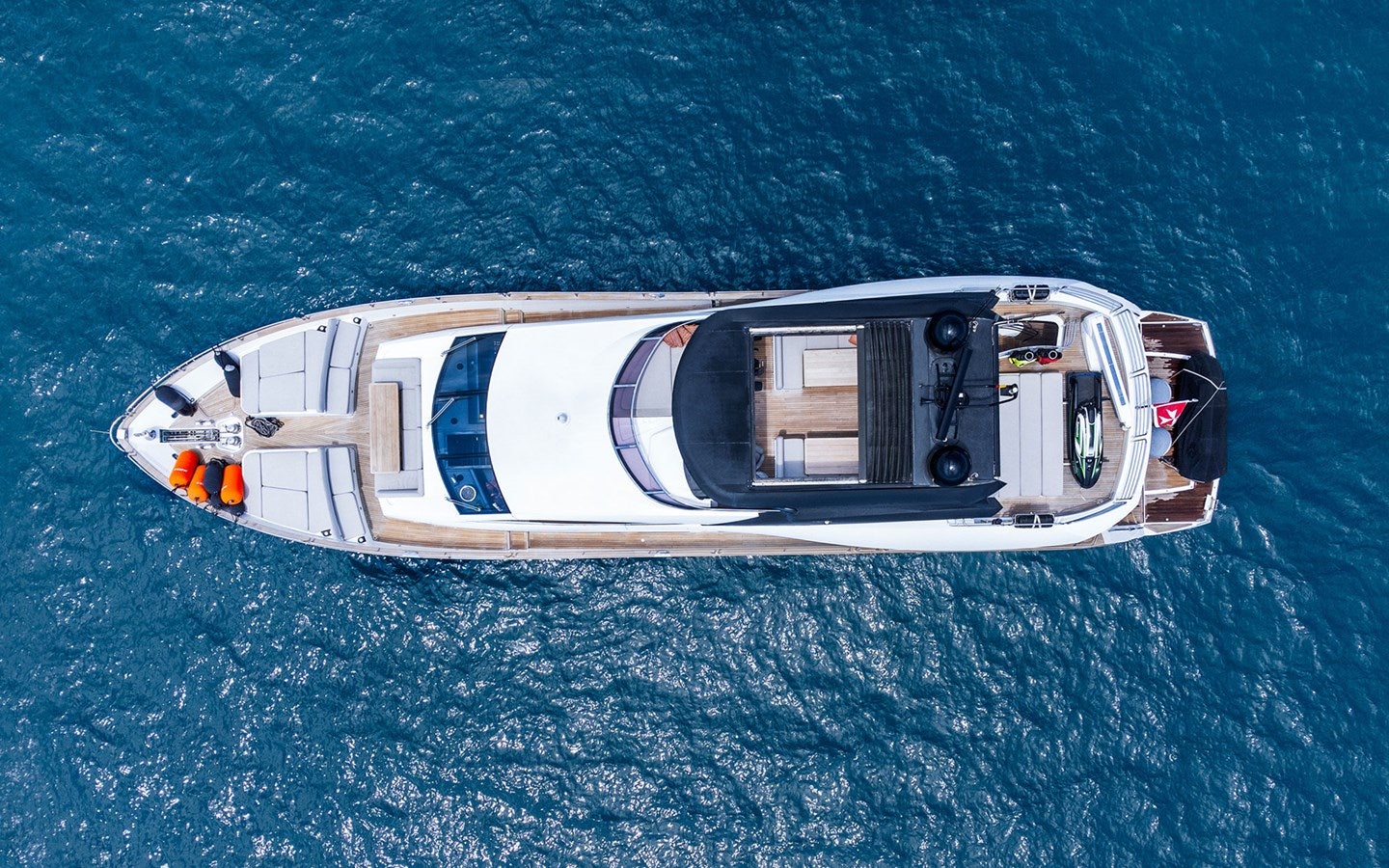 a white and black helicopter aboard MIRKA Yacht for Charter