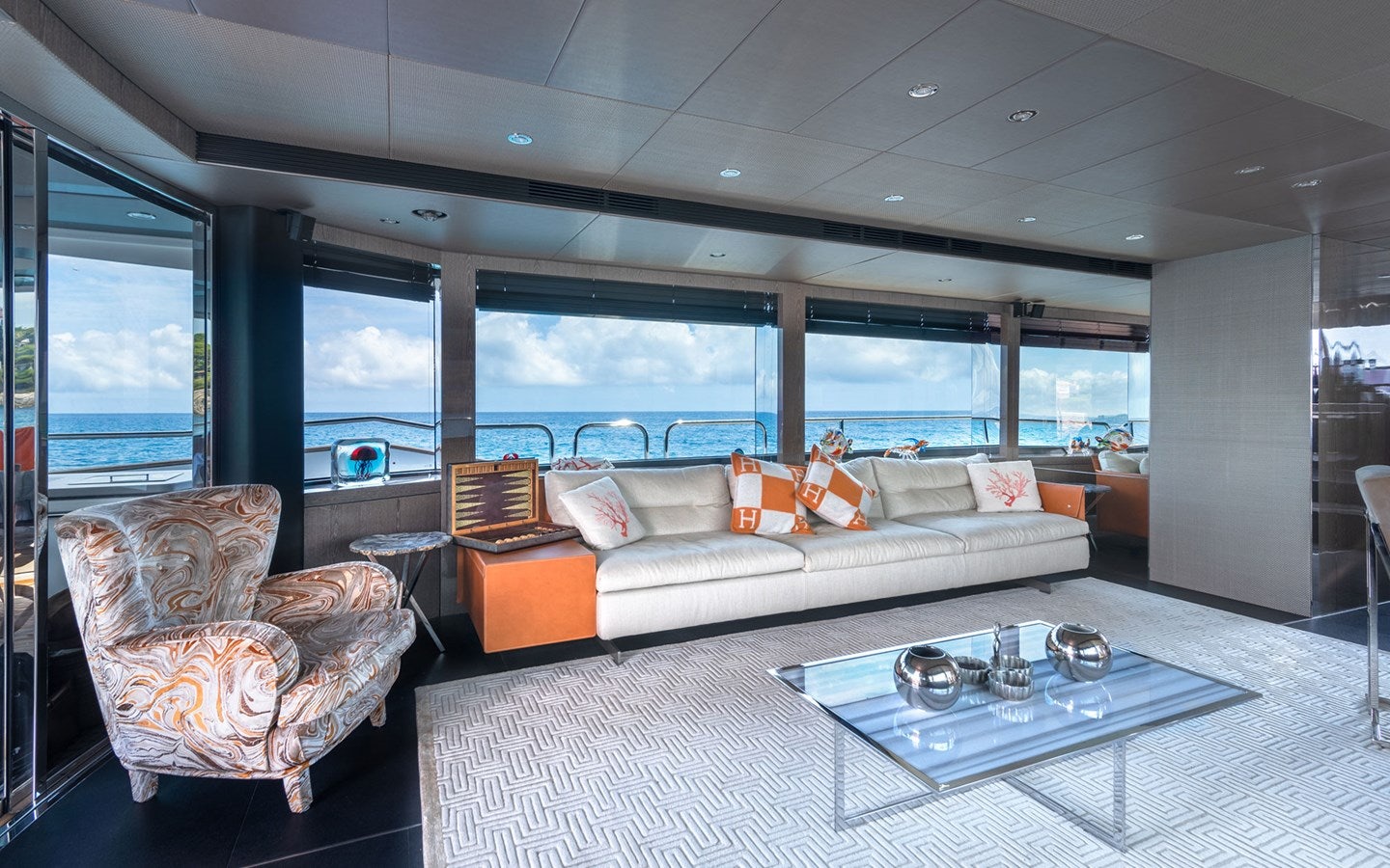a living room with a large window aboard MIRKA Yacht for Charter