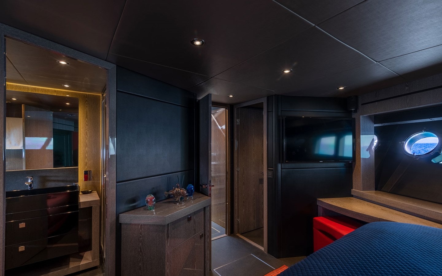 a room with a desk and a bed aboard MIRKA Yacht for Charter