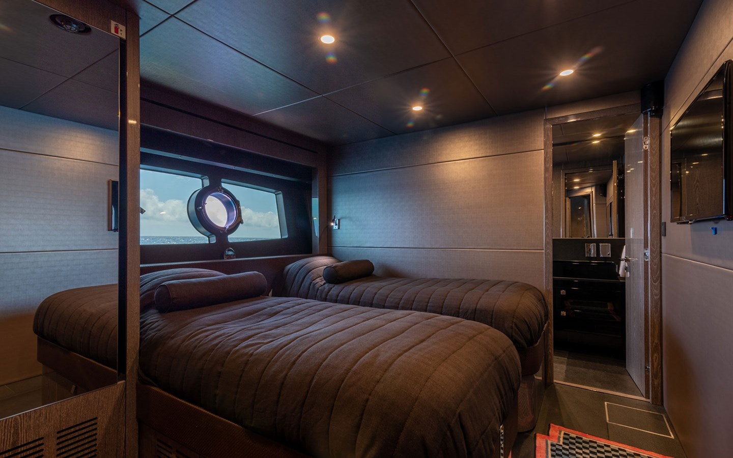 a bedroom with a large bed aboard MIRKA Yacht for Charter