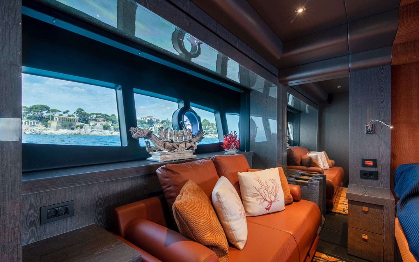 a living room with a large window aboard MIRKA Yacht for Charter